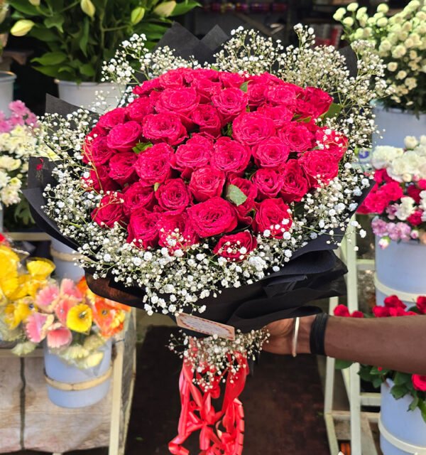 50 Roses with White Baby's Breath in Black Woven Paper